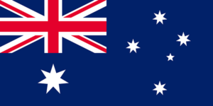 Bandera de Australia: Azul con la Union Jack en la esquina superior izquierda, una gran estrella blanca debajo y cinco estrellas del Cruce del Sur en el lado derecho.