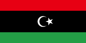 Bandera de Libia: Un campo simple color rojo con una media luna blanca y una estrella de cinco puntas en el centro.