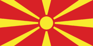 Bandera de Macedonia del Norte: Roja con un sol radiante amarillo en el centro.